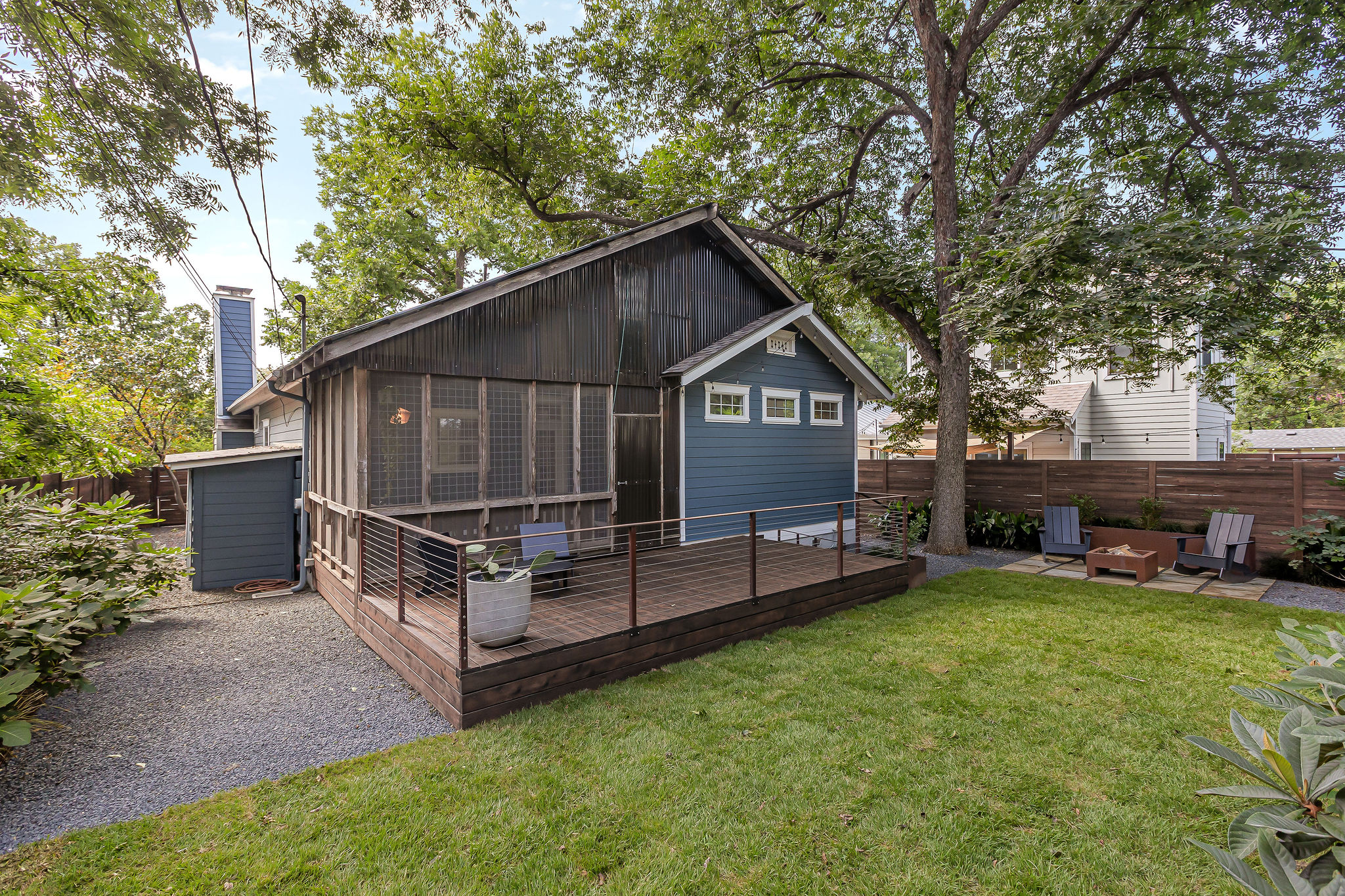 5108 Eilers Avenue Austin, TX 78751 - Photo 8 of 39 Spacious backyard with exterior deck and screened-in porch