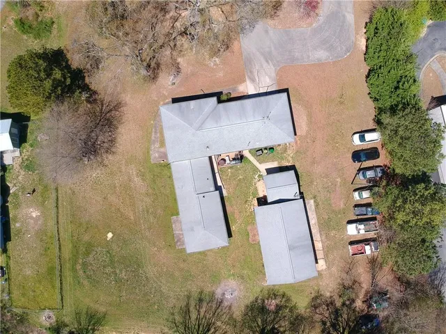 an aerial view of a house with outdoor space