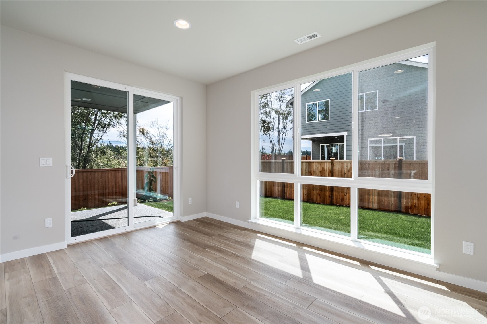 2452 Ridgeway Drive Oak Harbor, WA 98277 - Photo 10 of 10 a view of a room with wooden floor and windows