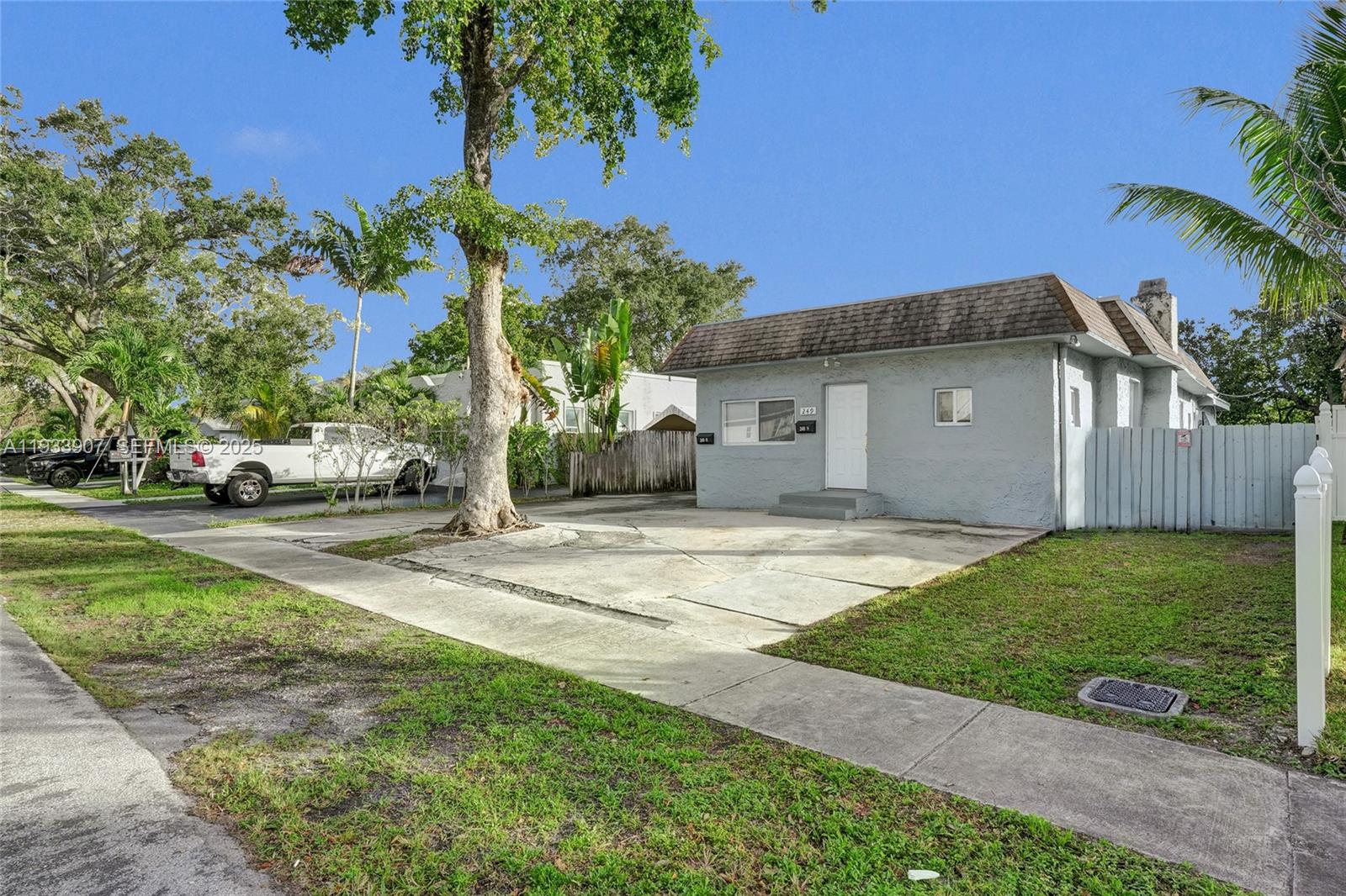 249 Southwest 4th Street, Unit 2 Dania Beach, FL 33004 - Photo 26 of 26 a view of a house with a yard