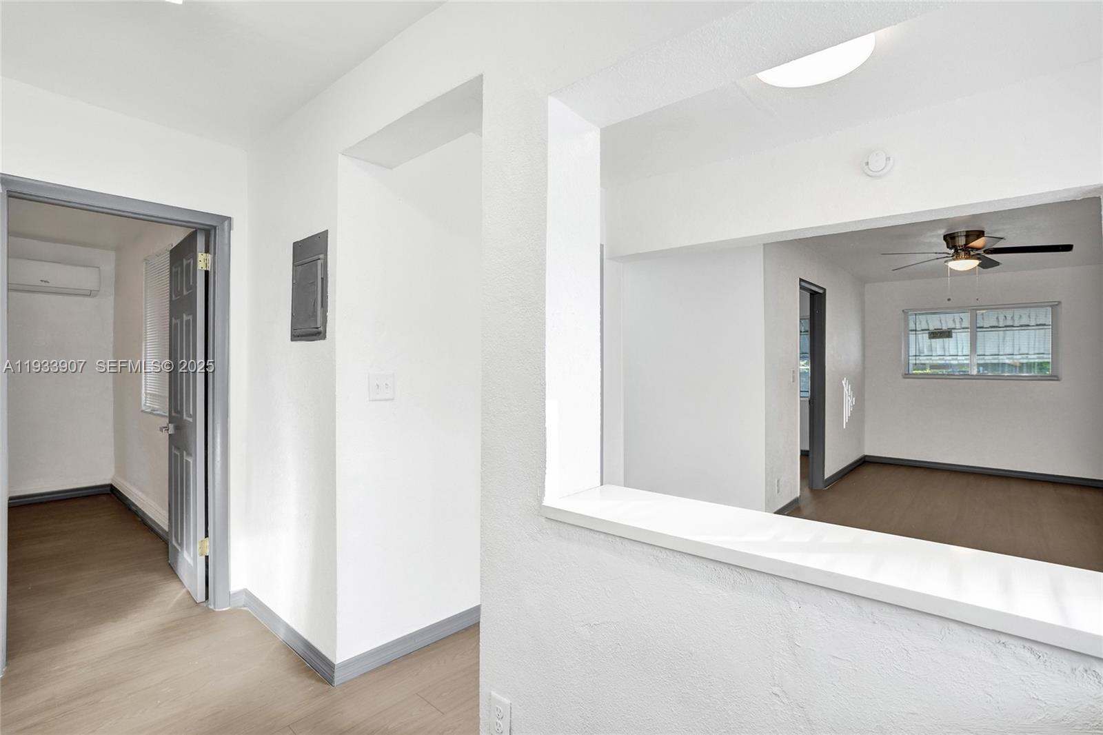 249 Southwest 4th Street, Unit 2 Dania Beach, FL 33004 - Photo 5 of 26 an empty room with windows and closet