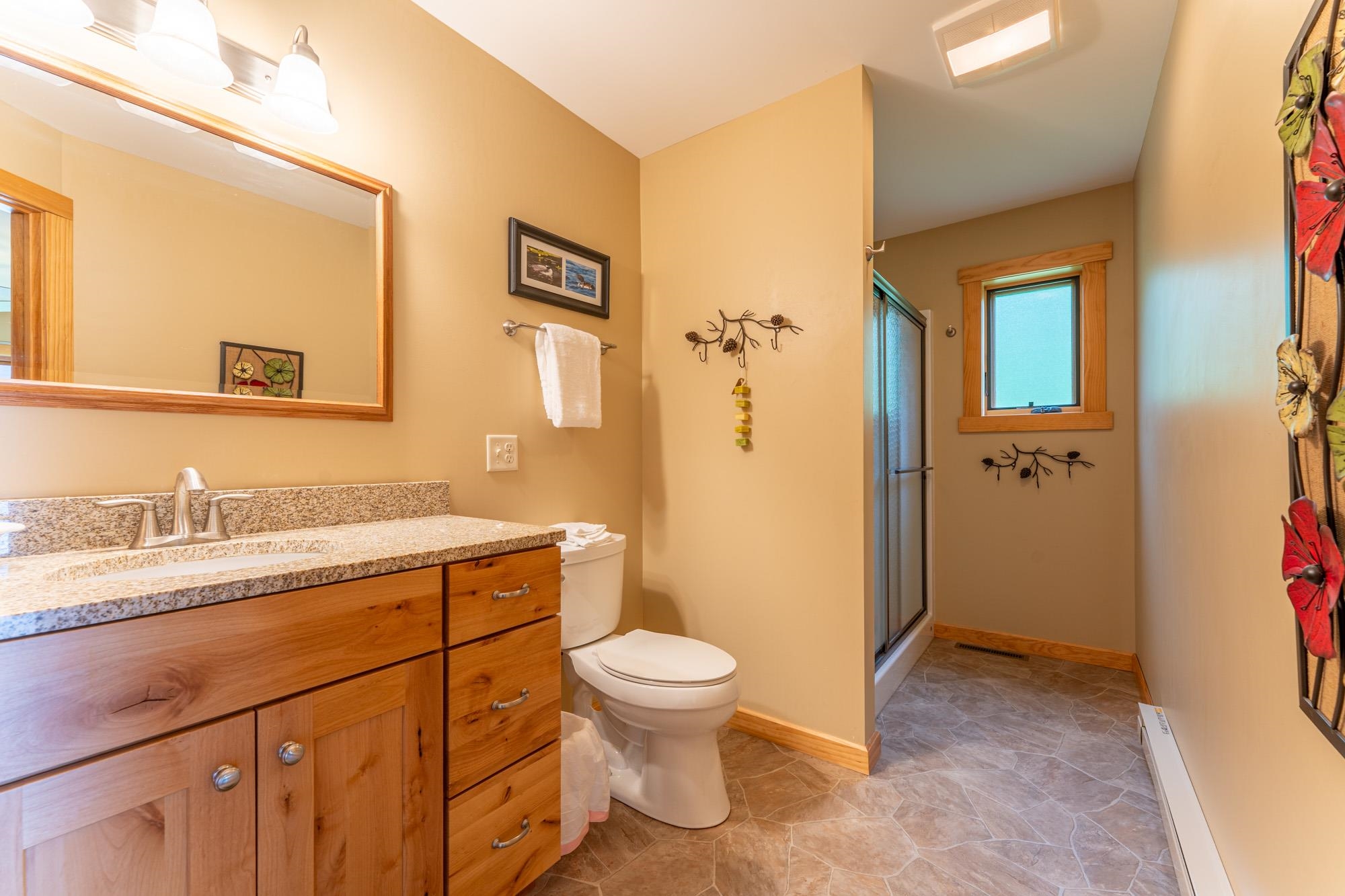 1663 Saari Road Ely, MN 55731 - Photo 11 of 31 Full bathroom featuring vanity and a stall shower