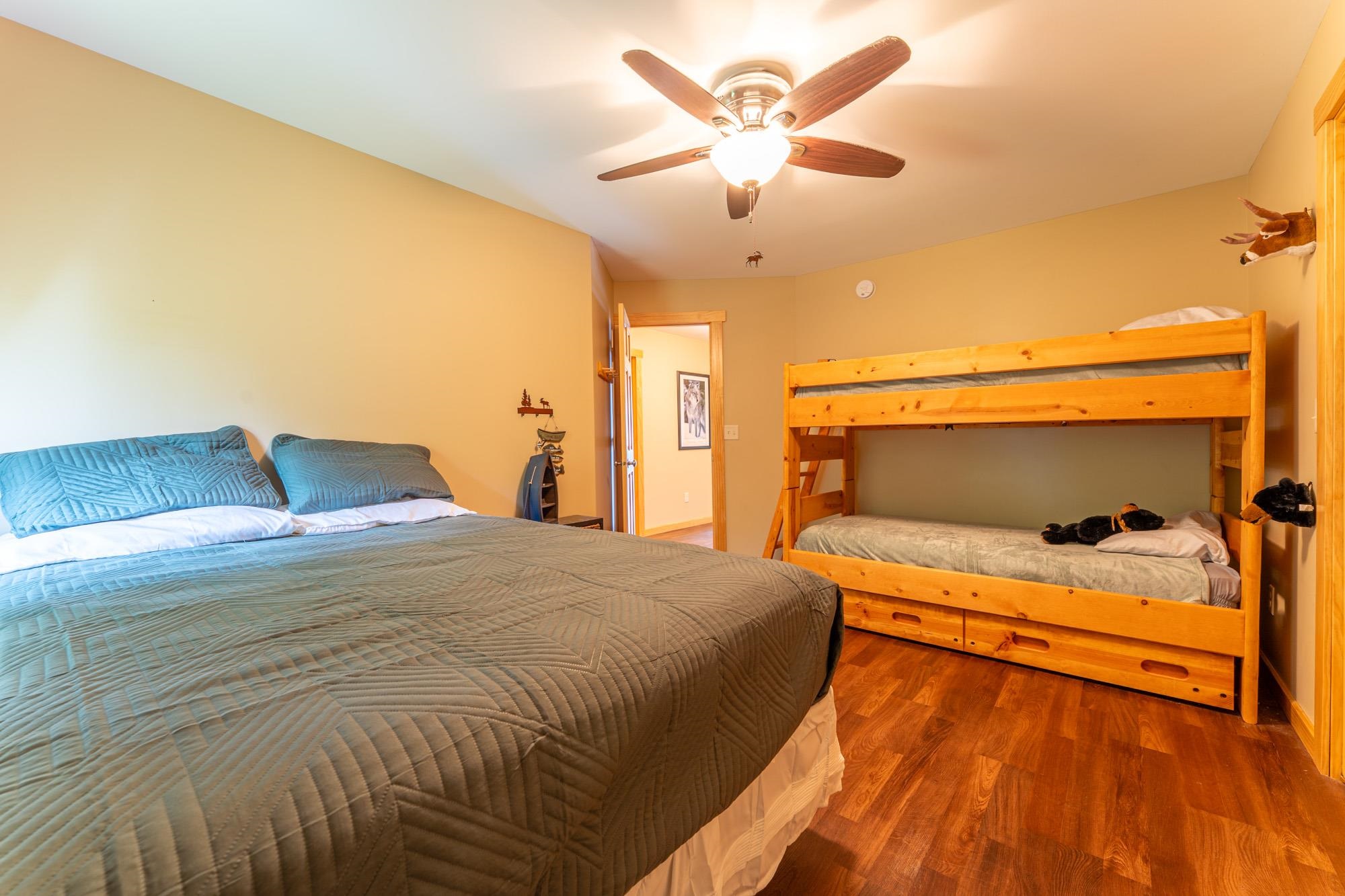1663 Saari Road Ely, MN 55731 - Photo 13 of 31 Bedroom featuring wood finished floors and ceiling fan