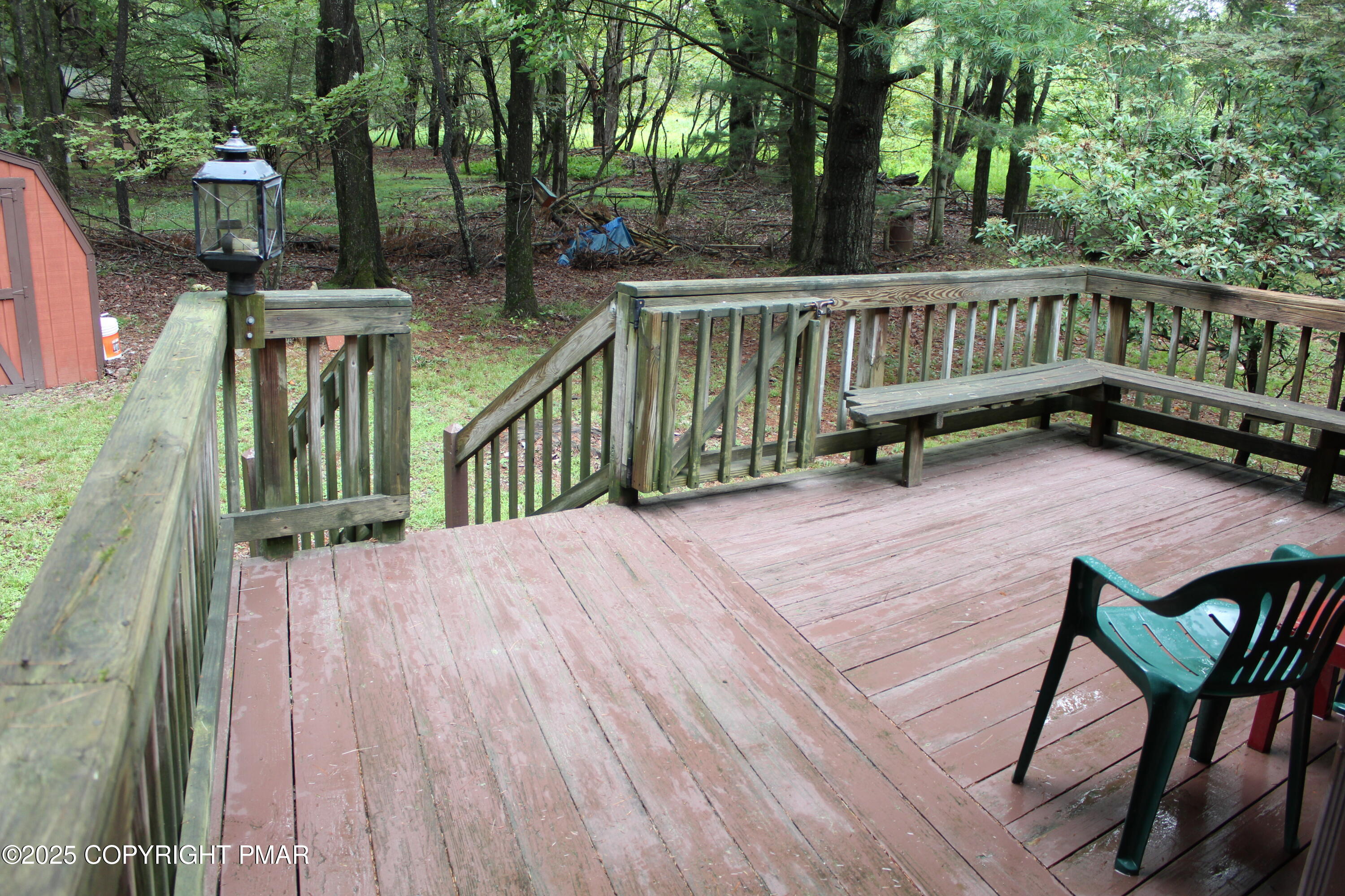 125 Red Squirrel Road Blakeslee, PA 18610 - Photo 3 of 52 a view of a deck with two chairs and wooden fence