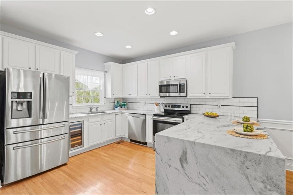1200 Wing Street, Unit 8 Atlanta, GA 30350 - Photo 11 of 54 a kitchen with a refrigerator stove and microwave