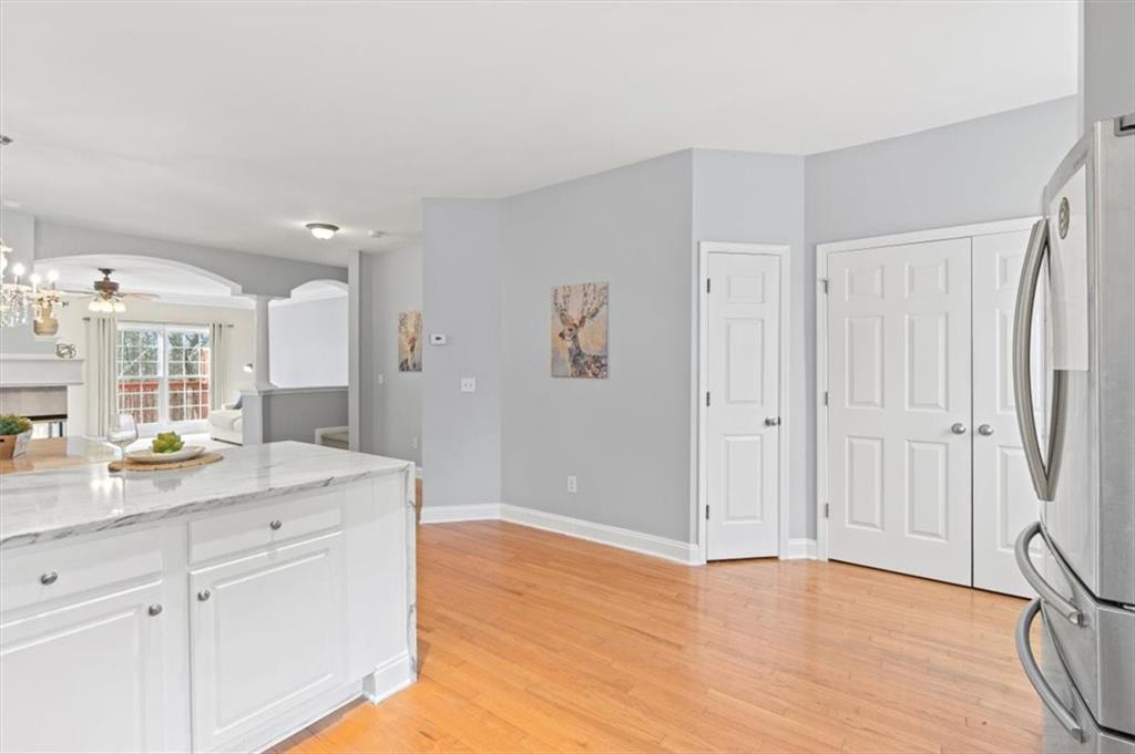 1200 Wing Street, Unit 8 Atlanta, GA 30350 - Photo 14 of 54 a view of a center island cabinets and wooden floor
