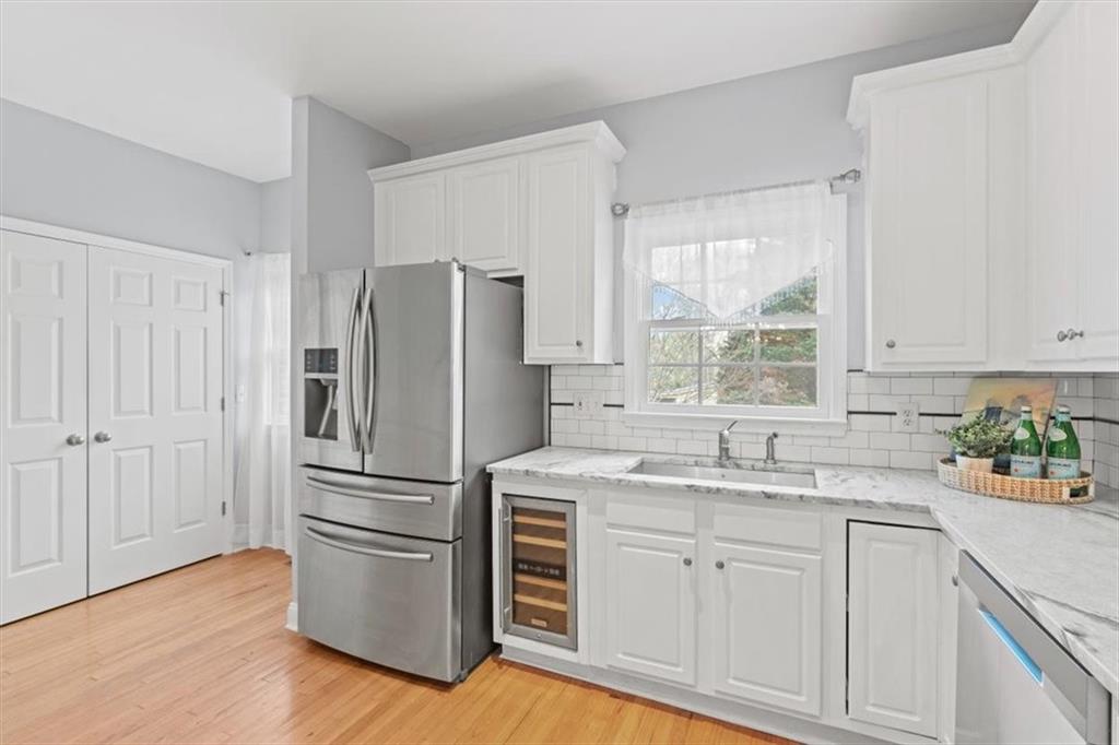 1200 Wing Street, Unit 8 Atlanta, GA 30350 - Photo 15 of 54 a kitchen with appliances cabinets a sink and a window