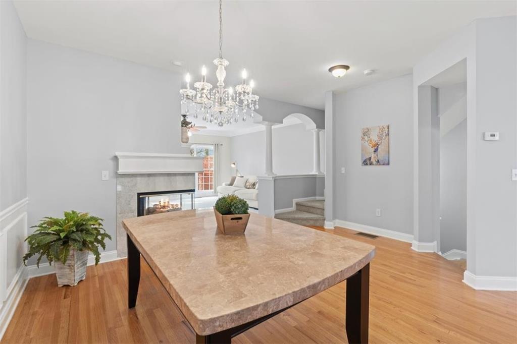 1200 Wing Street, Unit 8 Atlanta, GA 30350 - Photo 17 of 54 a view of a dining room with furniture and wooden floor