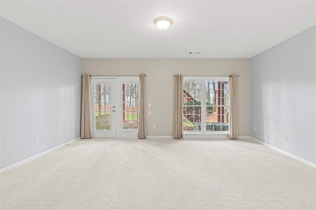 1200 Wing Street, Unit 8 Atlanta, GA 30350 - Photo 23 of 54 a view of an empty room with glass door