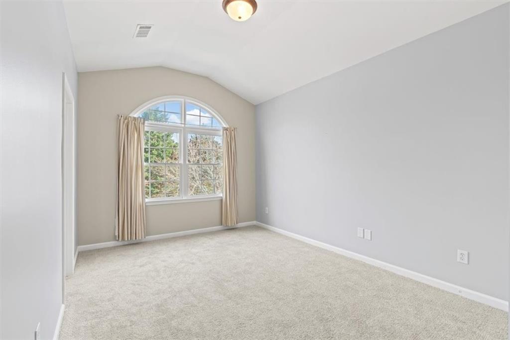 1200 Wing Street, Unit 8 Atlanta, GA 30350 - Photo 27 of 54 an empty room with windows and entrance