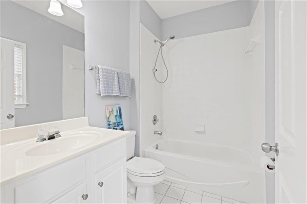 1200 Wing Street, Unit 8 Atlanta, GA 30350 - Photo 28 of 54 a bathroom with a sink a toilet and shower