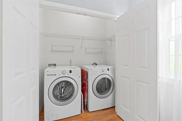 a wooden deck with trees in front of it