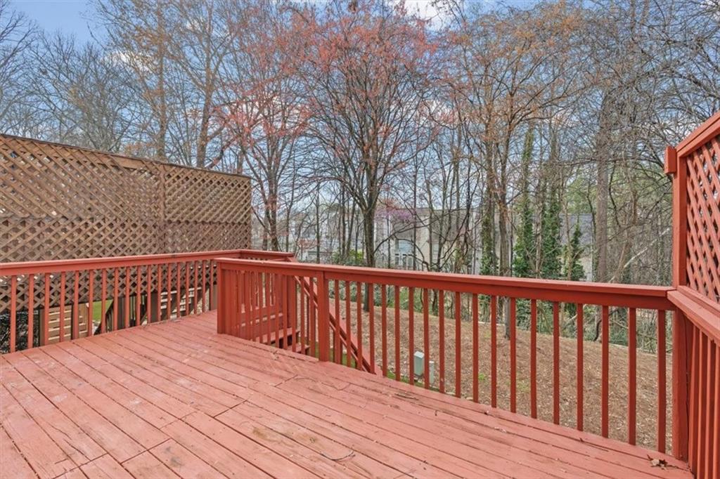 1200 Wing Street, Unit 8 Atlanta, GA 30350 - Photo 34 of 54 a wooden deck with trees in front of it