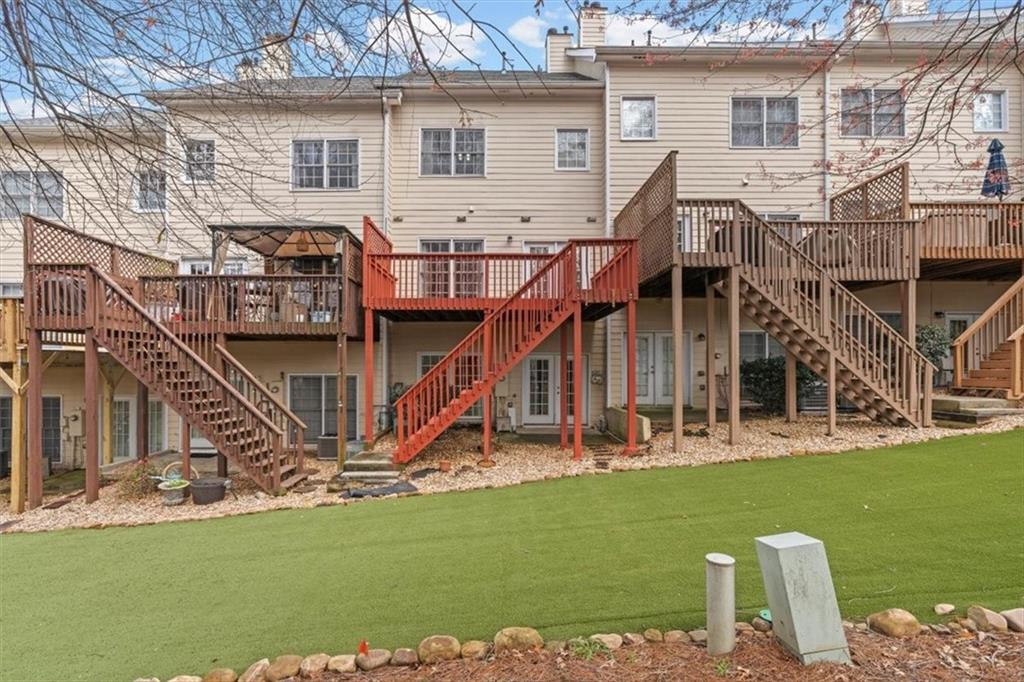 1200 Wing Street, Unit 8 Atlanta, GA 30350 - Photo 36 of 54 a view of a house with a yard