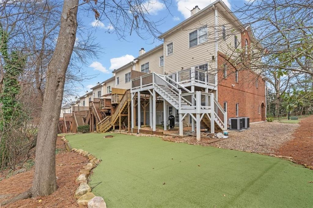 1200 Wing Street, Unit 8 Atlanta, GA 30350 - Photo 38 of 54 a view of a house with a yard