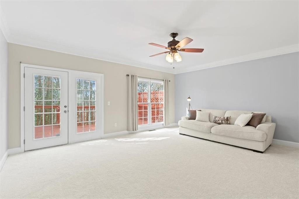 1200 Wing Street, Unit 8 Atlanta, GA 30350 - Photo 9 of 54 a living room with furniture and a large window