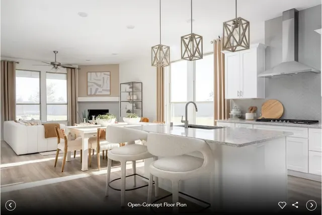 a kitchen with stainless steel appliances granite countertop a sink and a counter space