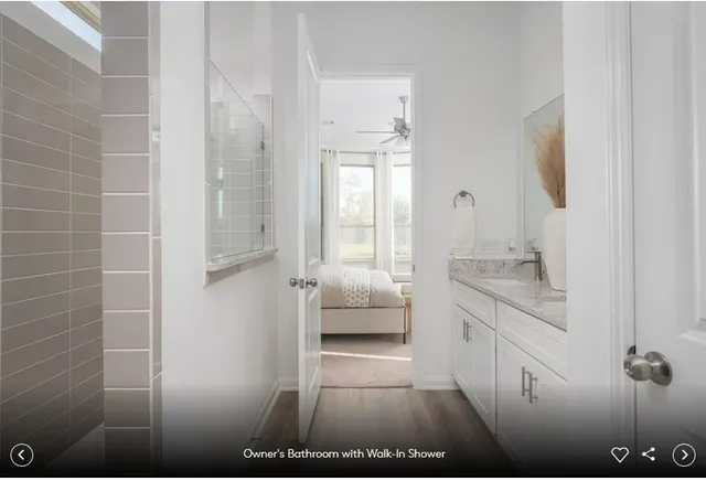 a bedroom with a bed couch and window