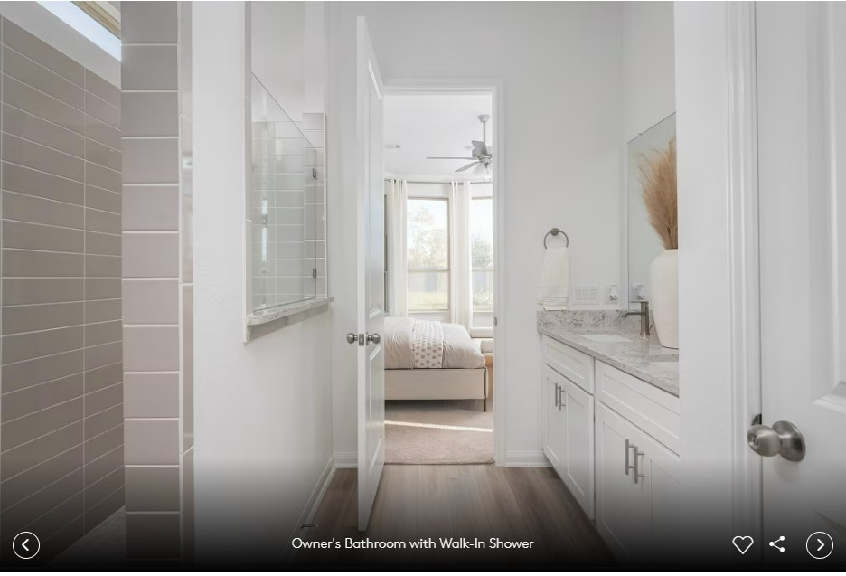 579 Rubber Tree Way Buda, TX 78610 - Photo 8 of 9 a bathroom with a granite countertop sink a toilet and shower