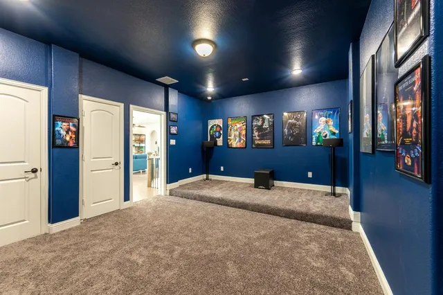 a large bedroom with a large bed and wooden floor