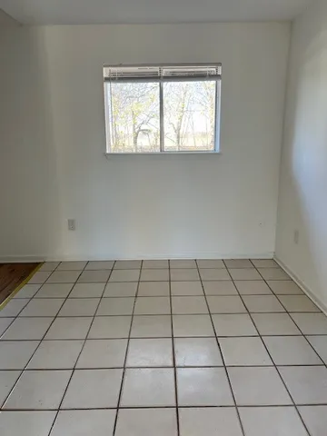 a view of an empty room and window