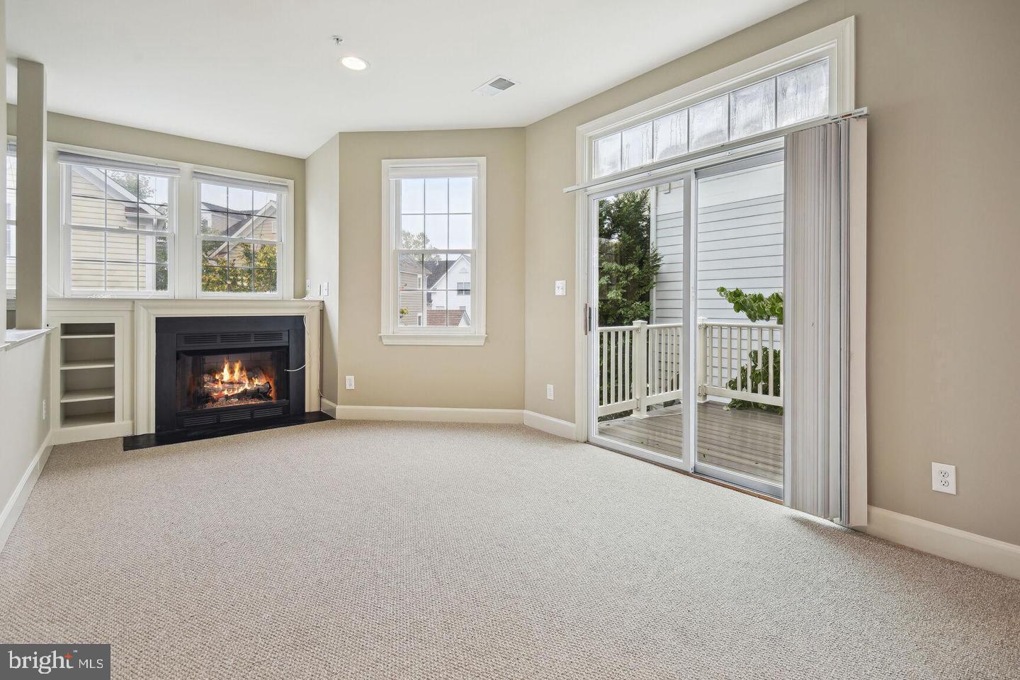 337 Main Street Gaithersburg, MD 20878 - Photo 14 of 35 a view of an empty room with a window and a fireplace