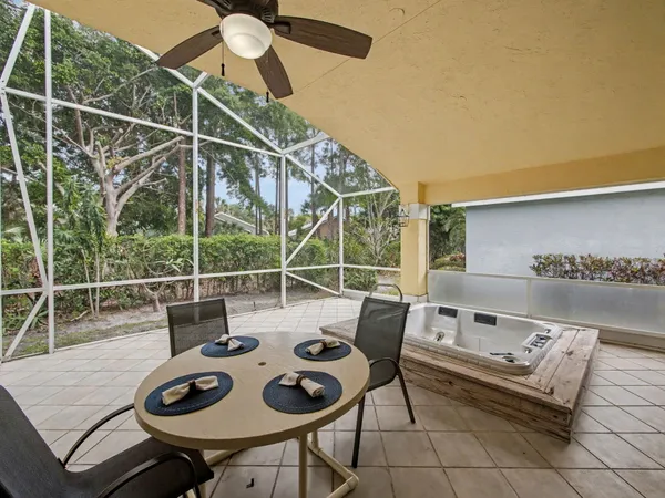 a view of a patio with a dining table and chairs