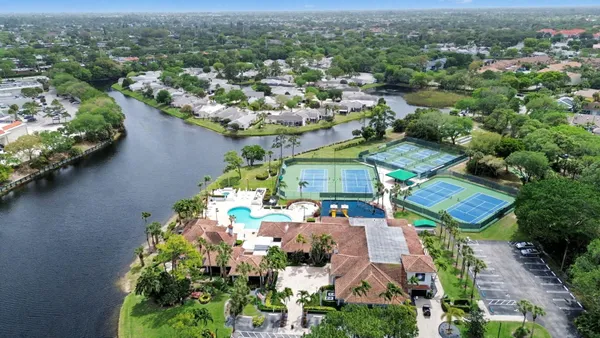an aerial view of a houses with a lake view