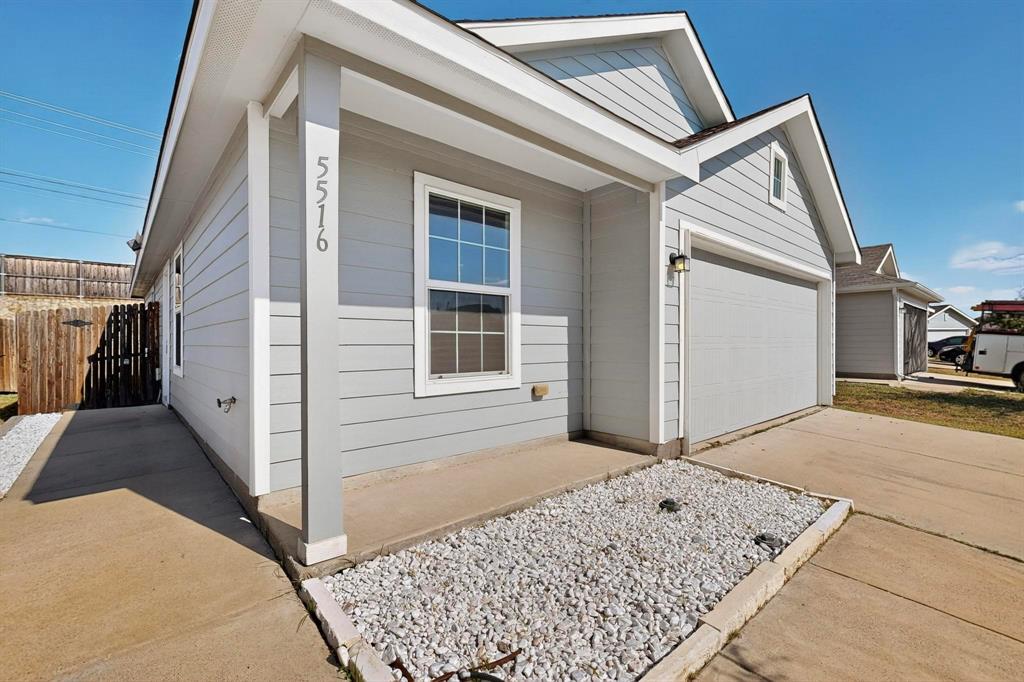5516 McClelland Street Forney, TX 75126 - Photo 35 of 36 View of home's exterior with concrete driveway and a porch