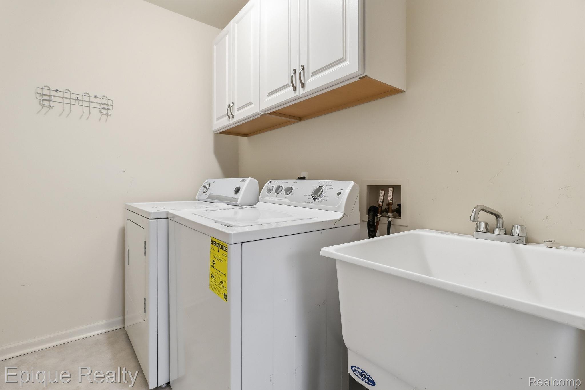 321 Cherry Grove Road Canton, MI 48188 - Photo 7 of 22 Laundry room with independent washer and dryer and cabinet space