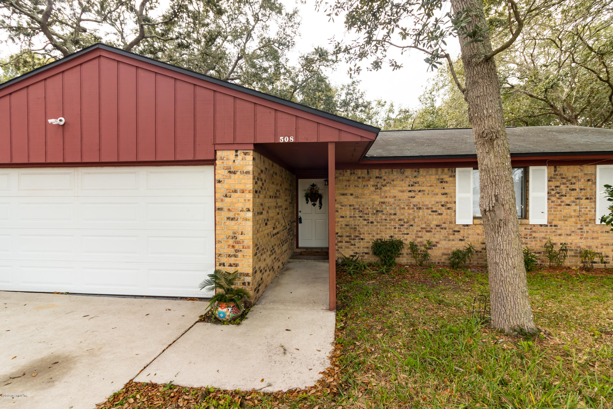 508 Penman Road Neptune Beach, FL 32266 - Photo 3 of 32 a front view of a house with a yard