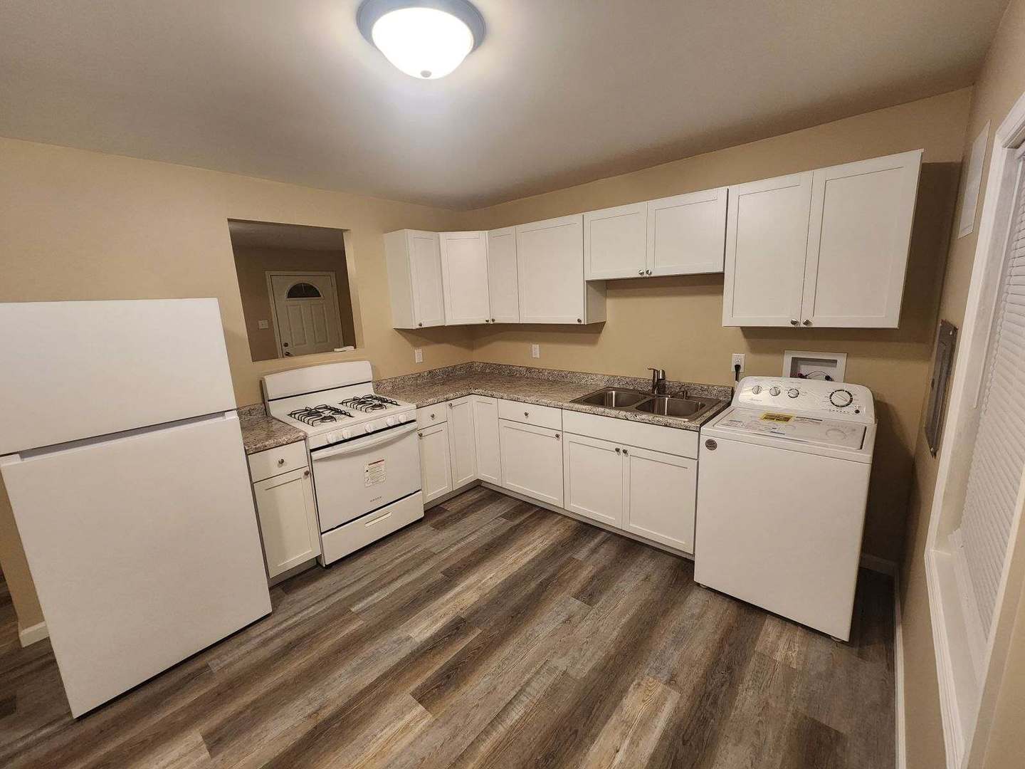 200 Louis Road Joliet, IL 60433 - Photo 3 of 20 a kitchen with white cabinets and white appliances
