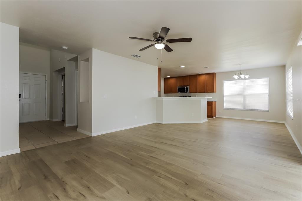 11420 Bay Gardens Loop Riverview, FL 33569 - Photo 3 of 17 a view of empty room with wooden floor and ceiling fan