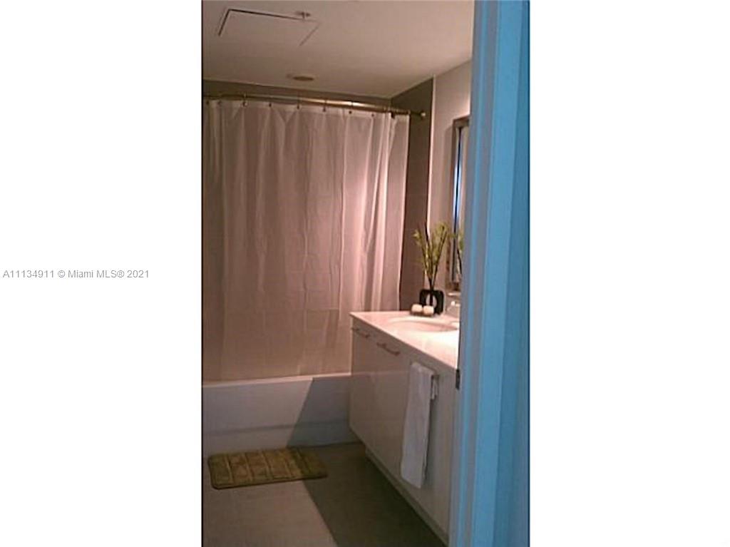 92 Southwest 3rd Street, Unit 3808 Miami, FL 33130 - Photo 13 of 15 a bathroom with a sink and a toilet