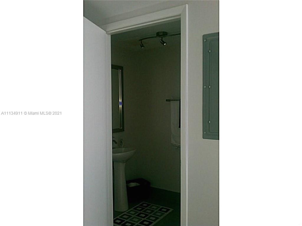 92 Southwest 3rd Street, Unit 3808 Miami, FL 33130 - Photo 14 of 15 a bathroom with a sink and a shower