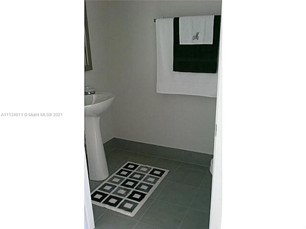 92 Southwest 3rd Street, Unit 3808 Miami, FL 33130 - Photo 15 of 15 a picture of a room with a door open and a microwave