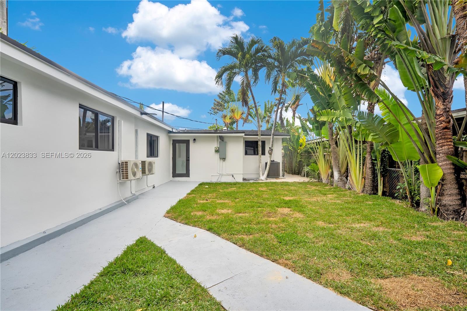6566 Southwest 35th Street Miami, FL 33155 - Photo 29 of 36 a front view of a house with garden