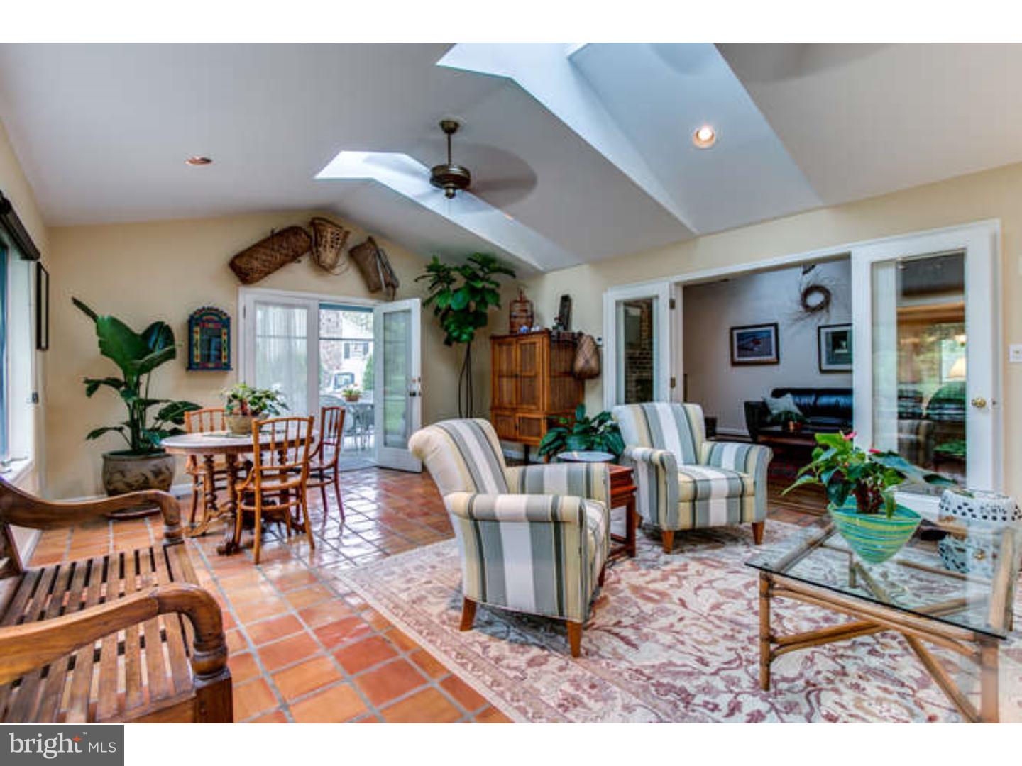 8 Squirrel Run Greenville, DE 19807 - Photo 11 of 24 a living room with furniture a window and a dining table