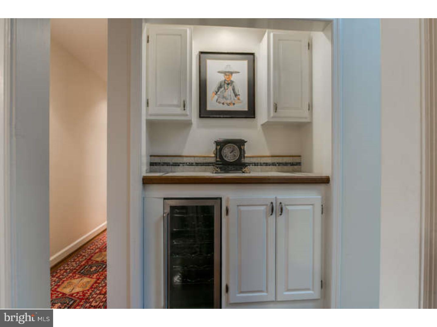 8 Squirrel Run Greenville, DE 19807 - Photo 14 of 24 a kitchen with a sink and cabinets