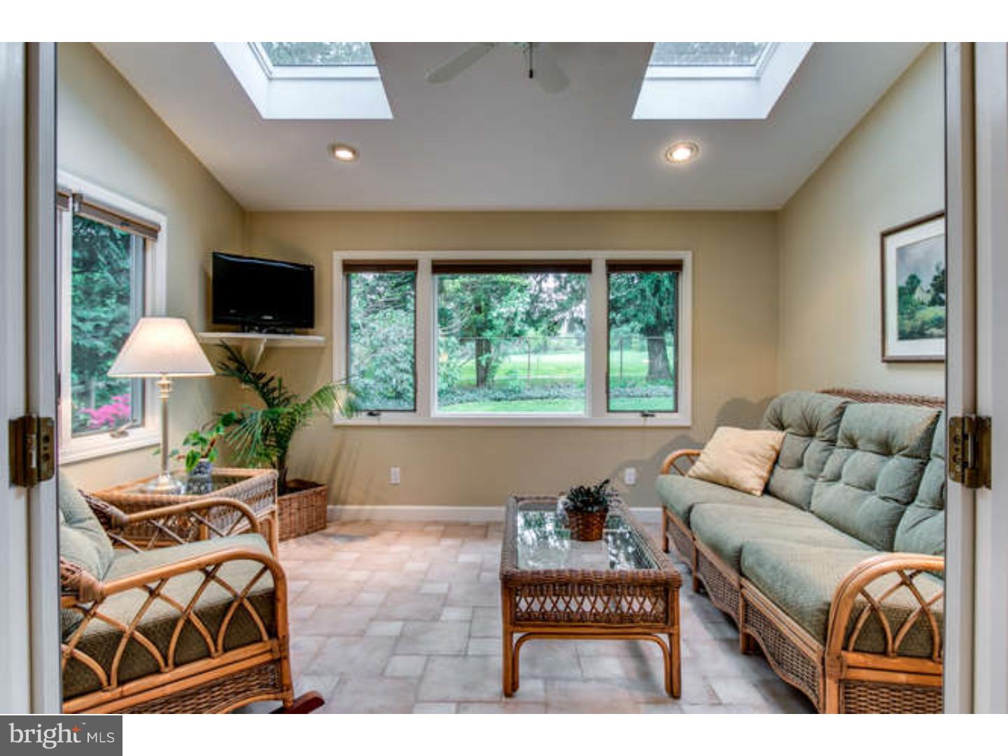 8 Squirrel Run Greenville, DE 19807 - Photo 16 of 24 a living room with furniture and a flat screen tv