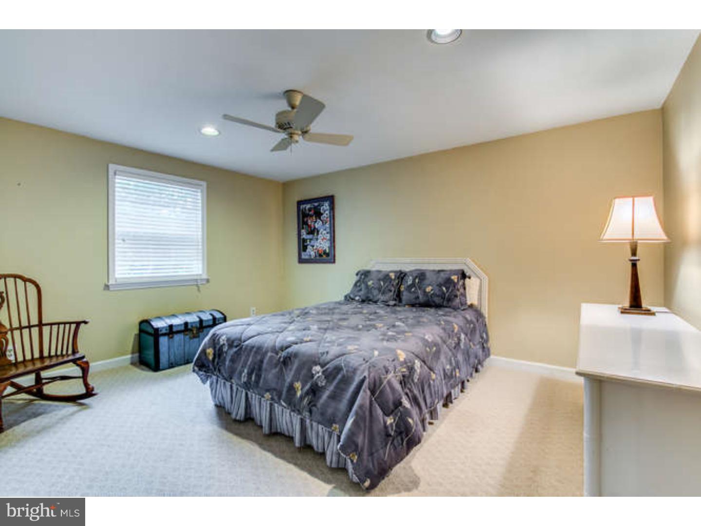 8 Squirrel Run Greenville, DE 19807 - Photo 19 of 24 a bedroom with a bed and window