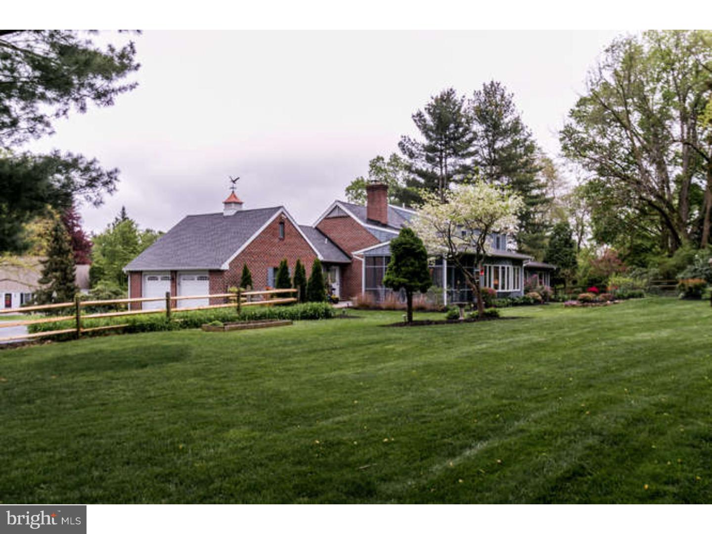 8 Squirrel Run Greenville, DE 19807 - Photo 24 of 24 a front view of a house with a garden