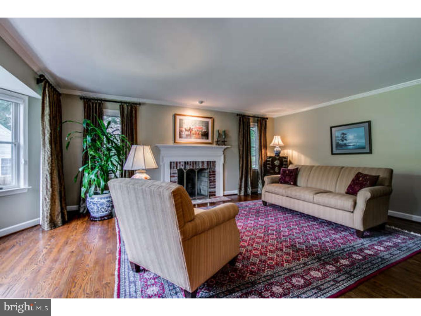 8 Squirrel Run Greenville, DE 19807 - Photo 4 of 24 a living room with furniture and a fireplace