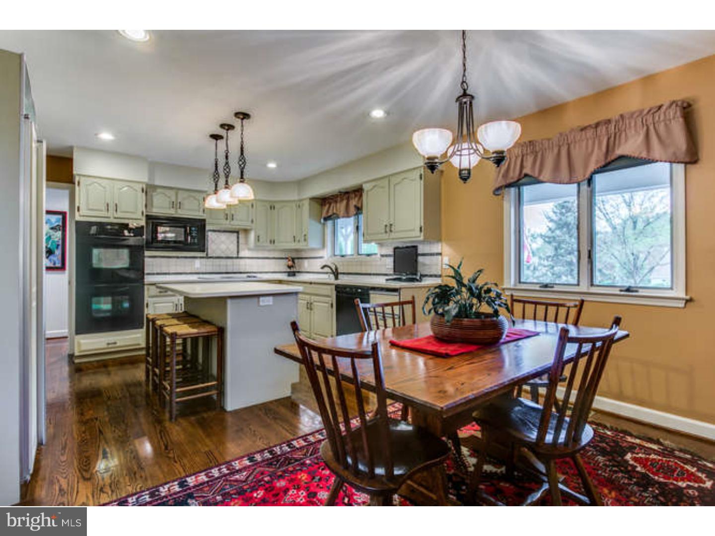 8 Squirrel Run Greenville, DE 19807 - Photo 7 of 24 a view of a dining room with furniture window and wooden floor