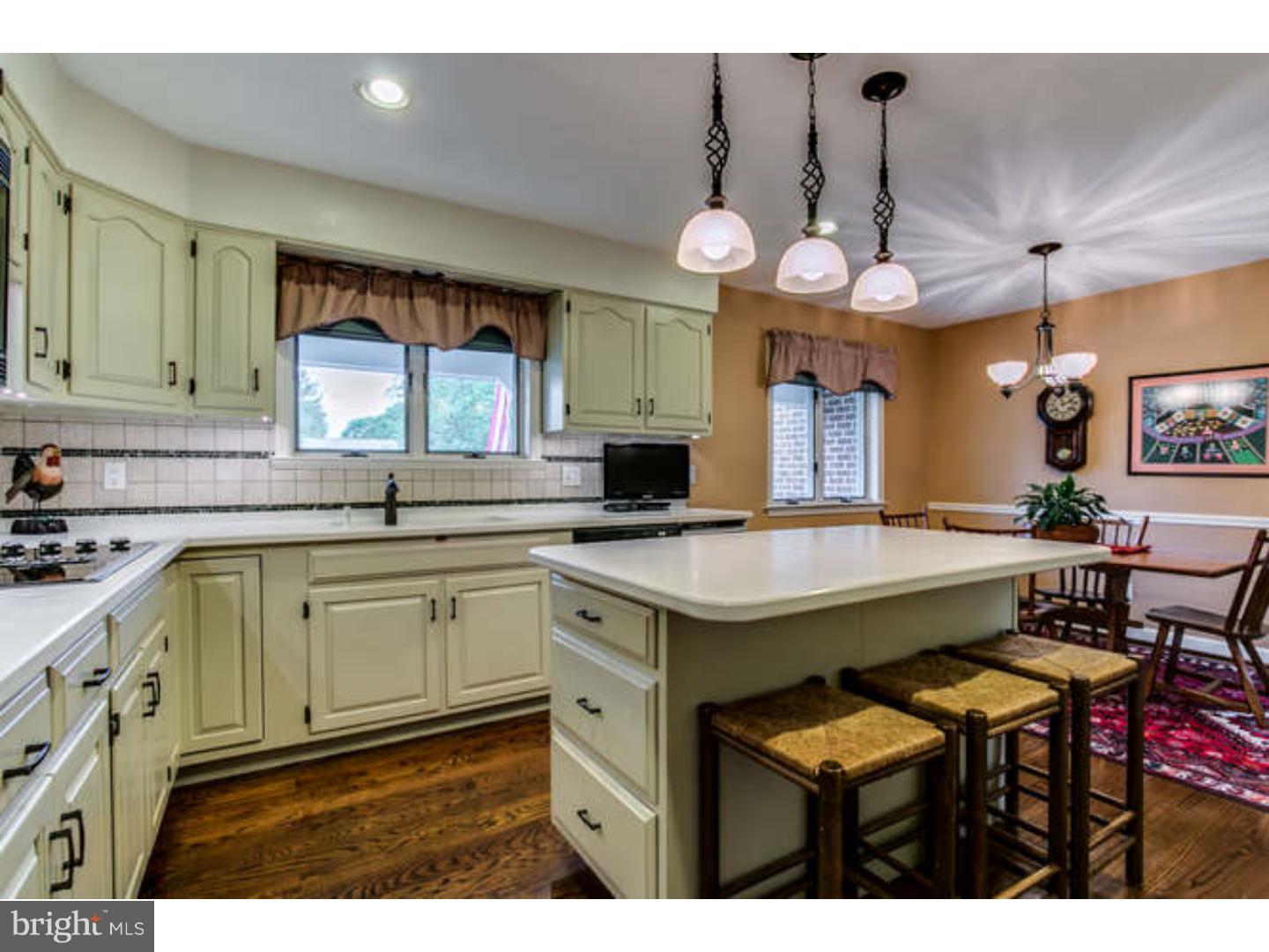 8 Squirrel Run Greenville, DE 19807 - Photo 8 of 24 a kitchen with a sink and cabinets