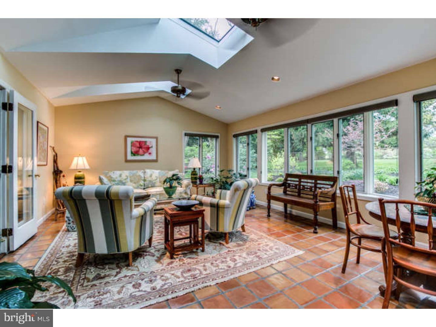 8 Squirrel Run Greenville, DE 19807 - Photo 10 of 24 a dining room with furniture a rug and a large window