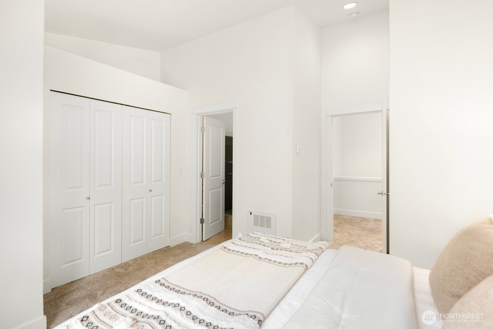 921 North 35th Street, Unit B Seattle, WA 98103 - Photo 15 of 28 a bedroom with a bed and a closet