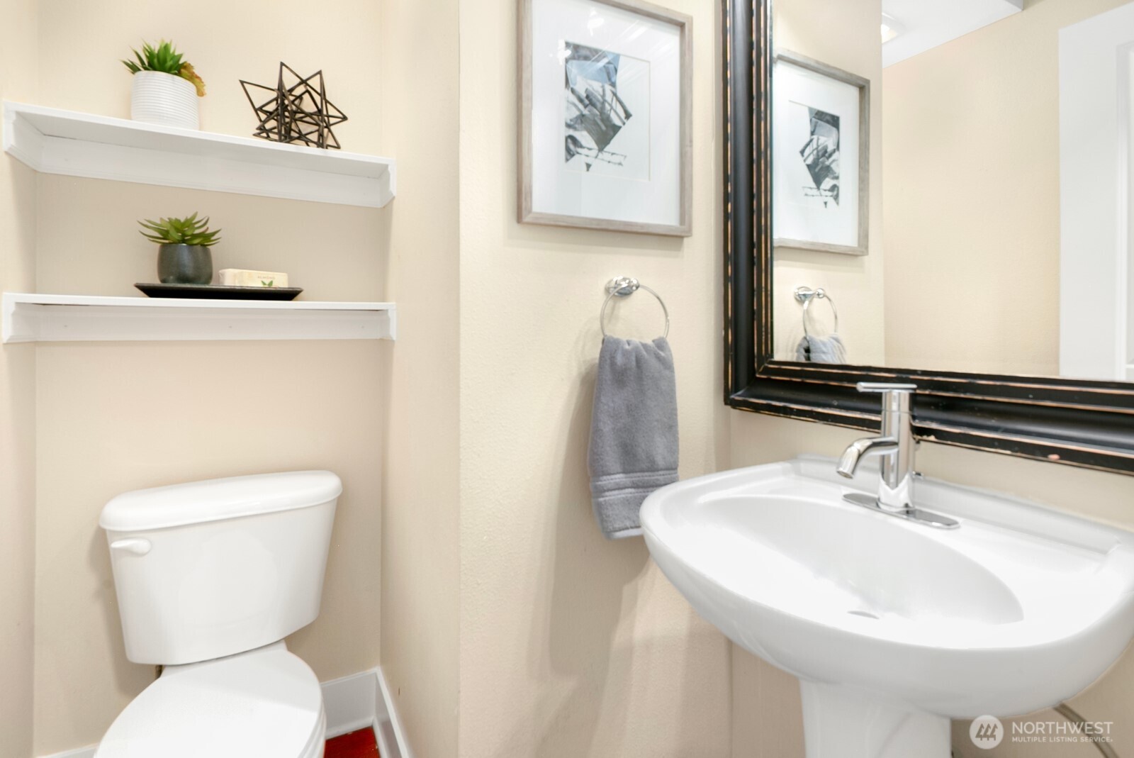 921 North 35th Street, Unit B Seattle, WA 98103 - Photo 17 of 28 a bathroom with a toilet sink and mirror