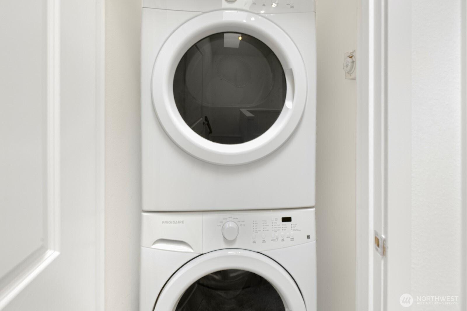 921 North 35th Street, Unit B Seattle, WA 98103 - Photo 21 of 28 a close up view of a washer and dryer