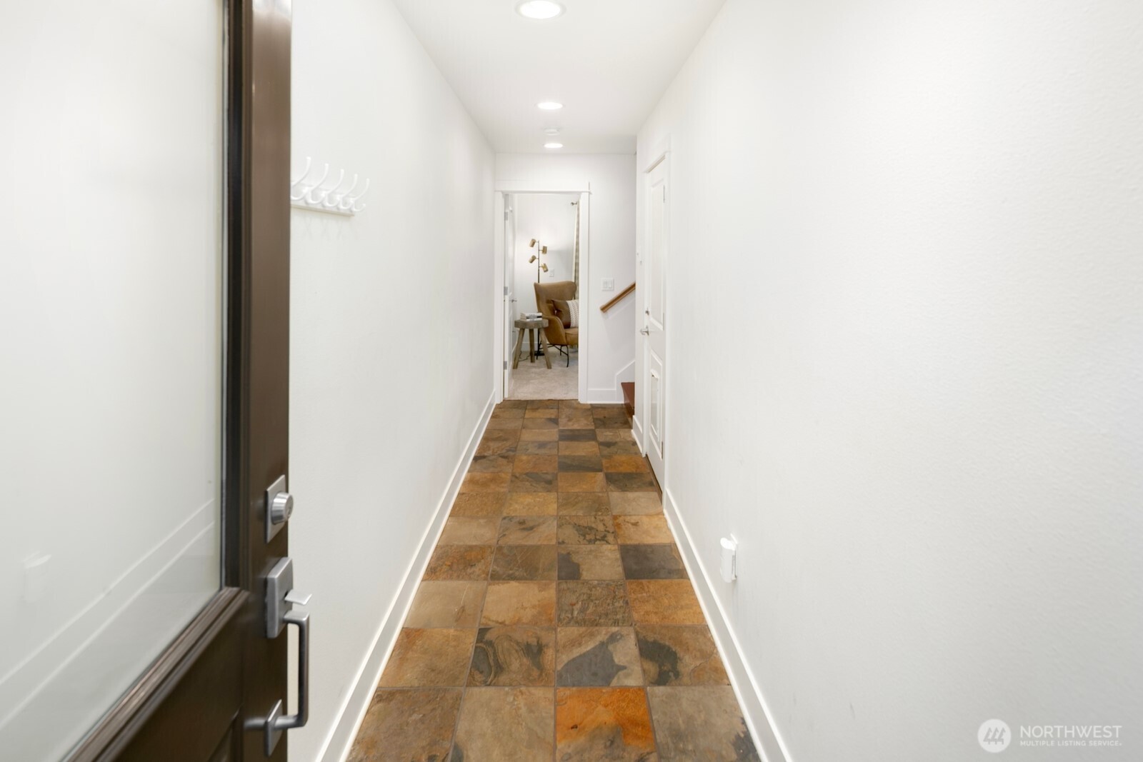 921 North 35th Street, Unit B Seattle, WA 98103 - Photo 22 of 28 a view of a hallway with wooden floor